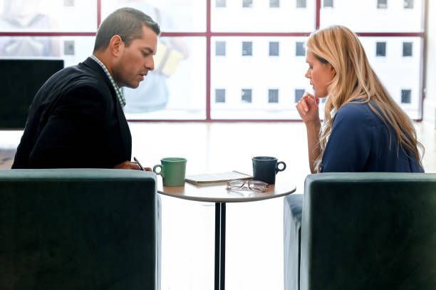 istock Coworkers or a professional and a client have a discussion 1208453303