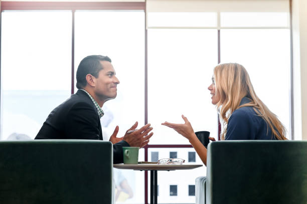 istock Coworkers or a professional and a client have a discussion 1208453829