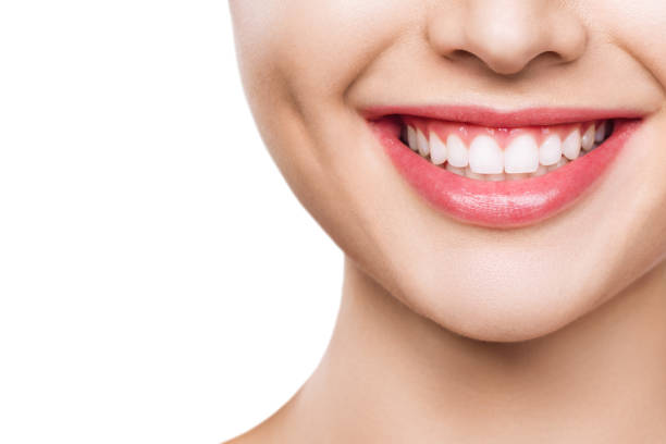 istock closeup of smile with white healthy teeth 1208454119