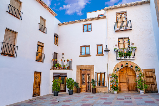 Javea Xabia spanish white Mediterranean facades with flower pots in Alicante of Spain