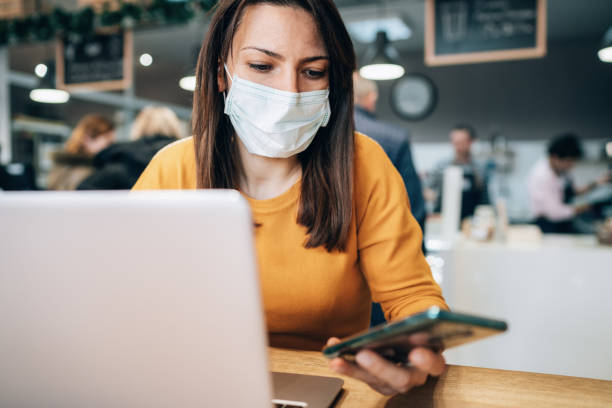 istock Woman with face protective mask 1208457324