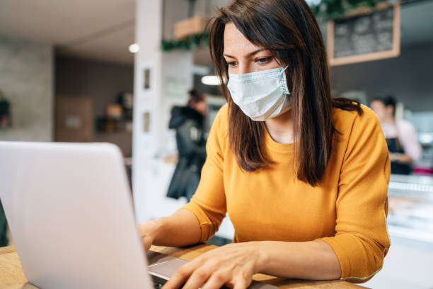 istock Woman with face protective mask 1208457325