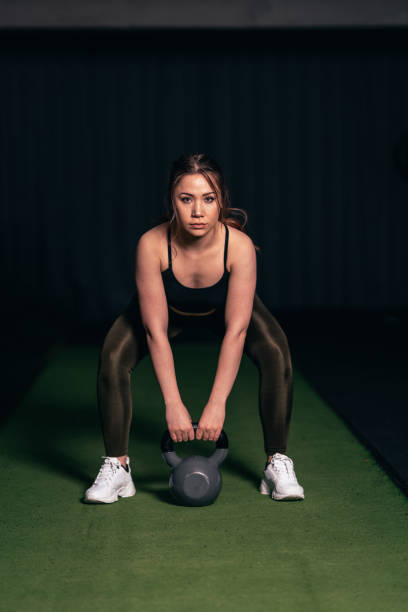 istock A young athlete doing a Goblet Squat, an athlete doing a leg movement 1208458303