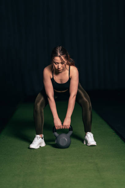 istock A young athlete doing a Goblet Squat, an athlete doing a leg movement 1208458363