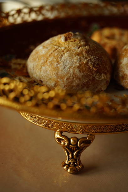 istock Gingerbread cookies in a beautiful dish with a gold carved patterned side and prop. 1208458511