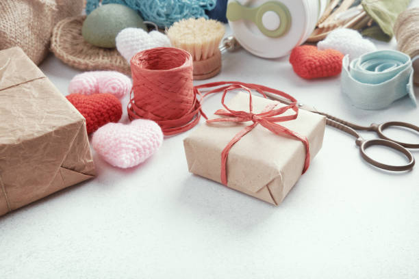 istock Set of eco presents laid out on the table. Zero waste gift wrapped in paper. 1208462016