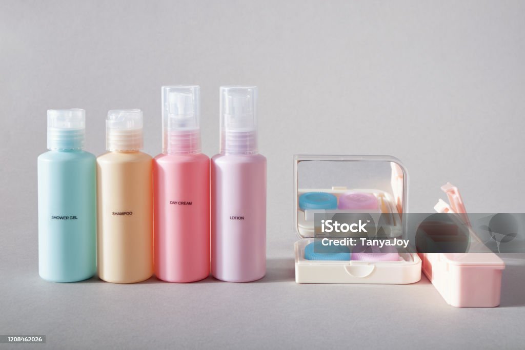 Travel Kit Set Of Four Small Plastic Bottles For Cosmetic Products Kit For  Contact Lenses Pill Organizer Gray Background Stock Photo - Download Image  Now - iStock