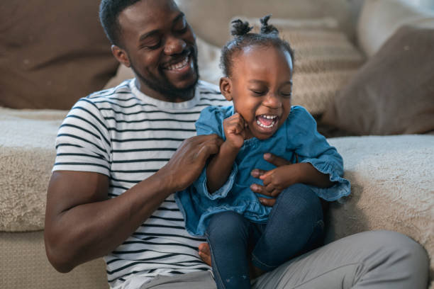 istock A father and daughter bond as they laugh together 1208469171