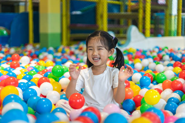 istock Cute girl at the Ball Pool 1208469368