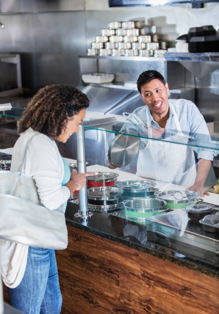 istock Hispanic customer ordering food in restaurant 1208475472