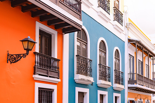 This is a color photograph of a the exterior of a colorful buildings in Old San Juan, Puerto Rico, USA.