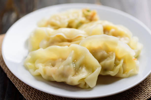 istock Steamed wonton dumpling stuffed with minced pork and shrimp 1208476245