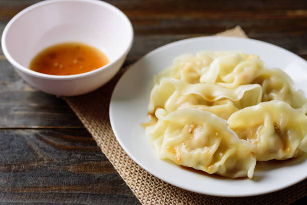 istock Steamed wonton dumpling stuffed with minced pork and shrimp 1208476260
