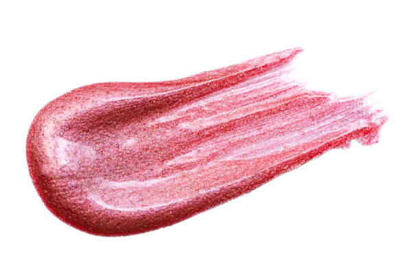 istock Lip gloss sample isolated on white. Smudged pink lipgloss. 1208477313