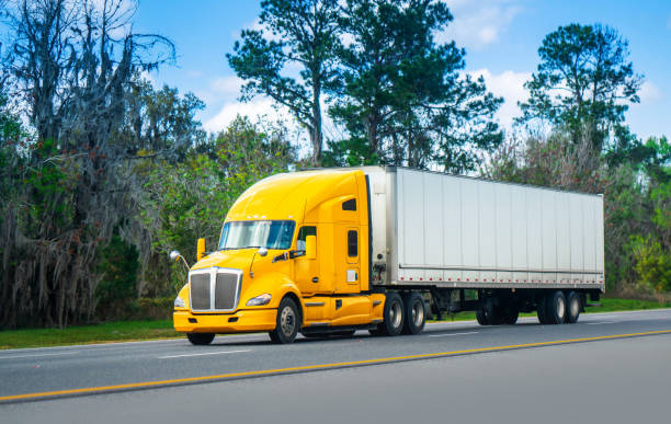 istock Yellow truck on the road 1208485138