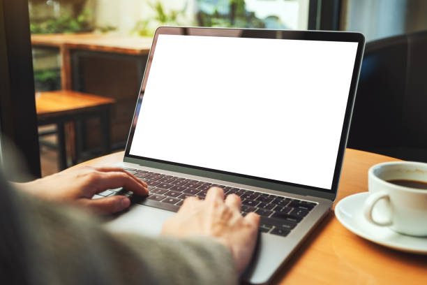 istock a woman using and typing on laptop computer with blank white desktop screen in cafe 1208486174