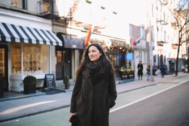 istock Young woman walking in Soho, Manhattan, NYC 1208486502