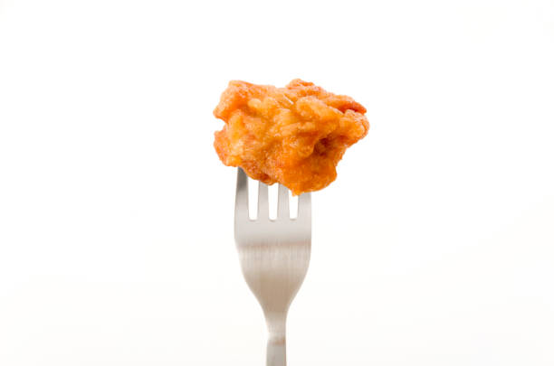 istock Japanese food, tori karaage, Fried chicken on a fork on white background 1208495926