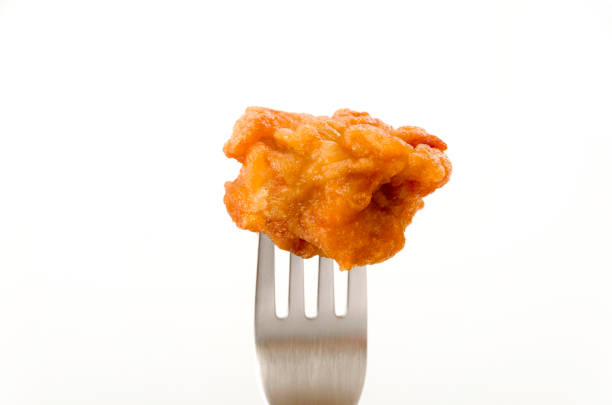 istock Japanese food, tori karaage, Fried chicken on a fork on white background 1208496486