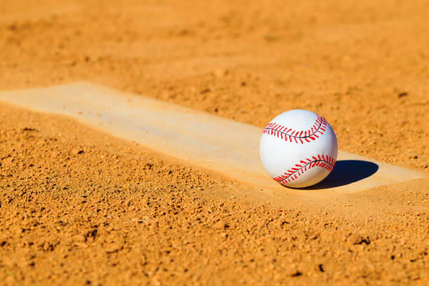istock Baseball or Softball on Dirt Mound 1208497350