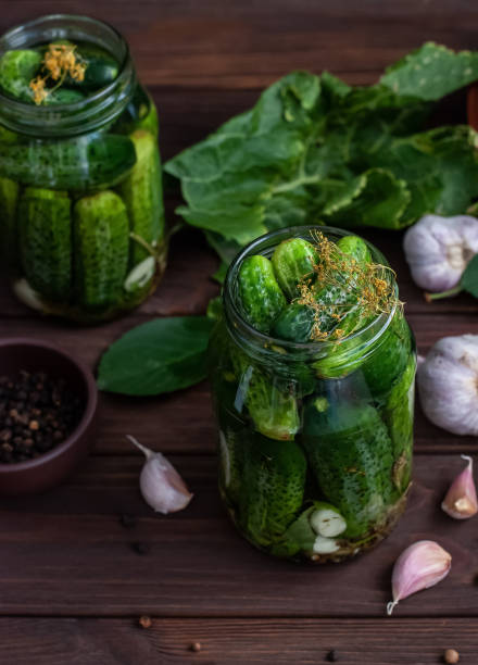istock Fermentation of cucumbers in glass jars 1208501370