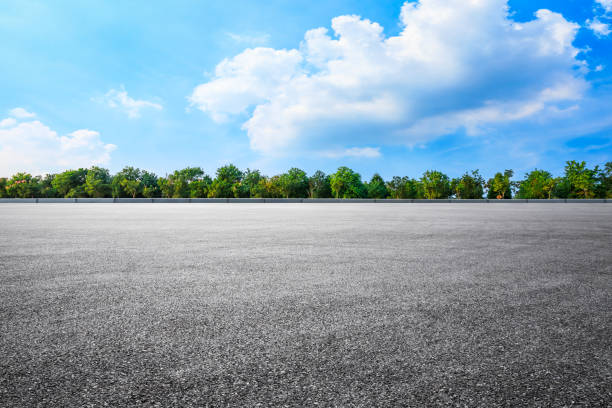 istock asphalt road and woods background landscape 1208503672