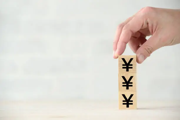 Photo of Increasing Japanese yen images with wooden blocks