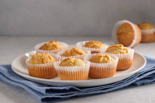 istock Delicate and delicious lemon cupcakes with crisp on a white plate 1208506652