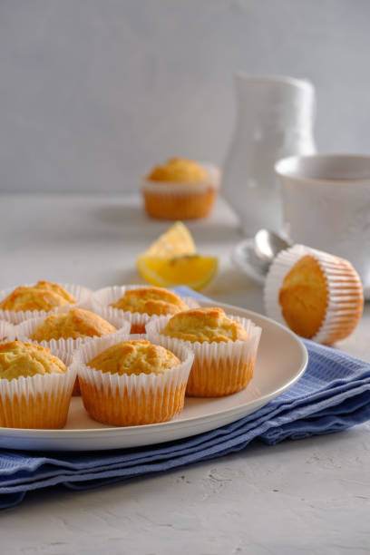 istock Delicate and delicious lemon cupcakes with crisp on a white plate 1208506655