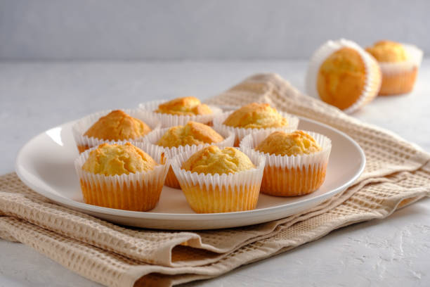 istock Delicate and delicious lemon cupcakes with crisp on a white plate 1208506673