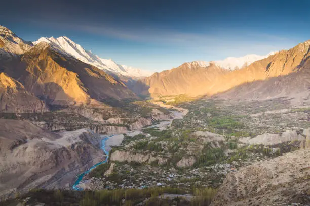 Photo of Natural view along Karakorum mountains at Hunza valley with Cherry blossom autumn season Pakistan