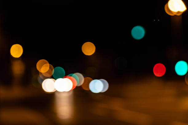 istock Blurred city lights of an intersection at night 1208508484