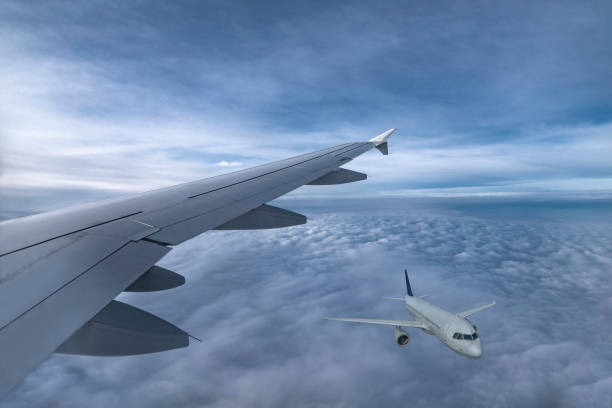 istock Wing of jet and airplane fly in sky above clouds. View from plane window 1208508603