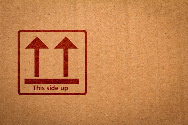 istock This Side Up sign in a packaging box. Arrow mark indicating correct way to ship/store the package. 1208508707