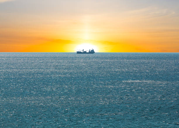 istock alone ship in a sea at the sunset 1208508799