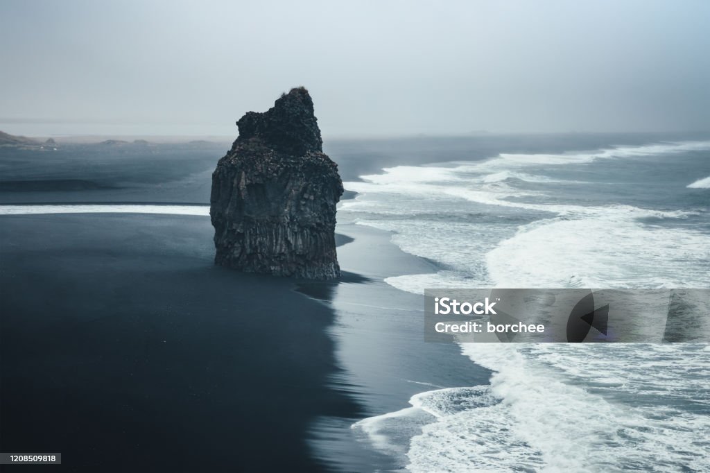 Black Beach Dramatic black-sand beach Reynisfjara on Iceland. Rock - Object Stock Photo