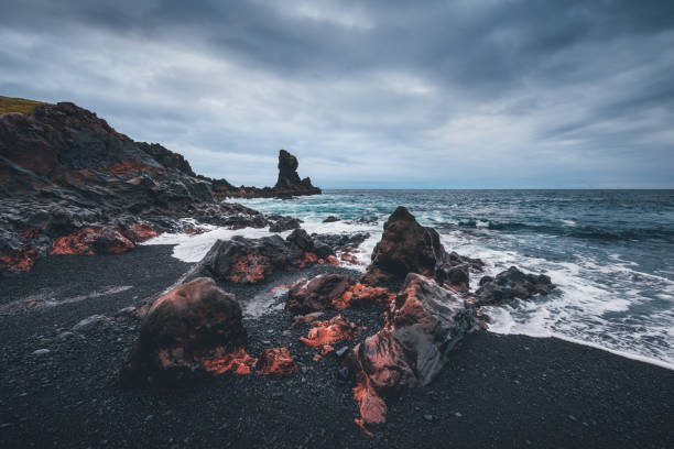 Dramatic black beach in Iceland (Djupaldnssandur beach, Snaefellsnes peninsula).