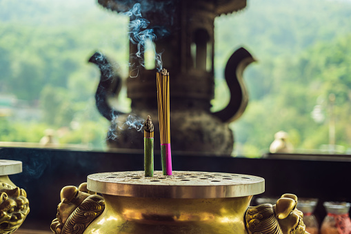 Burning aromatic incense sticks. Incense for praying Buddha or Hindu gods to show respect.