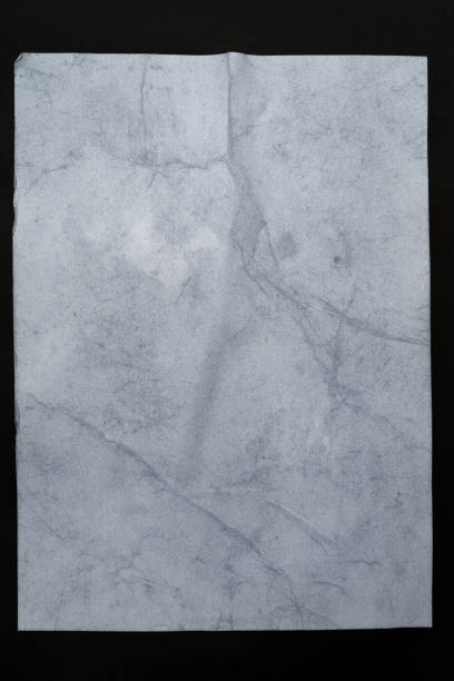 istock Wet white paper glued to the wall. Wet paper texture. 1208511794