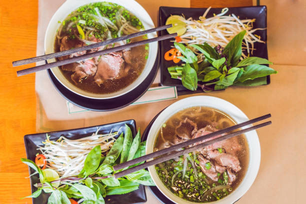 Pho Bo - Vietnamese fresh rice noodle soup with beef, herbs and chili. Vietnam's national dish