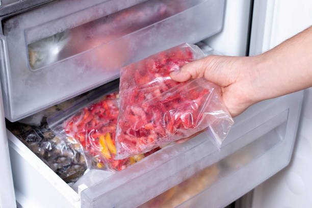 istock Frozen vegetables in bags in refrigerator 1208513173