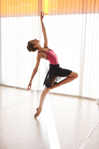 istock young female ballet dancer at the studio 1208513952