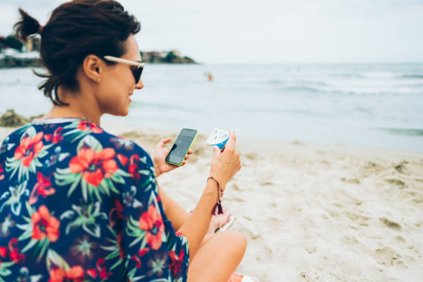 istock Online shopping at the beach 1208517754