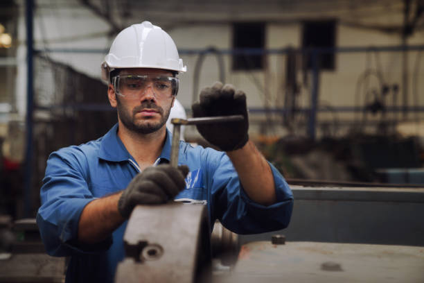 istock Engineers and skilled technicians are maintaining machinery. Technicians and engineers are working and repairing machines in industrial plants. 1208517761