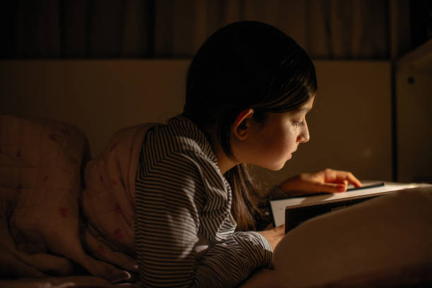 istock little girl doing her homework 1208519003