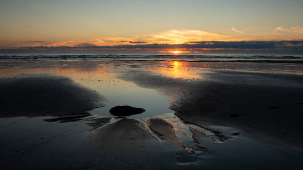 istock Sunset over the west coast of Taranaki 1208520022