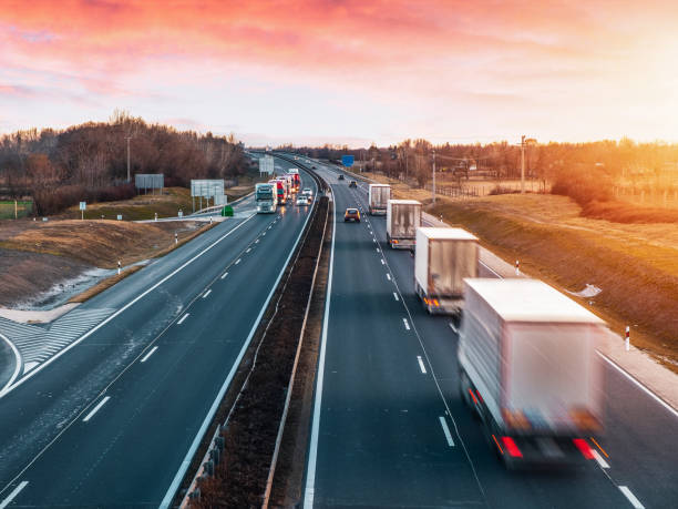 istock Busy highway with fast moving vehicles in beautiful sunset 1208520438