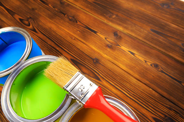 istock House renovation, paint cans on the old wooden background with copy space 1208521297