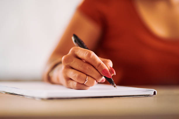 istock Putting pen to paper 1208521316