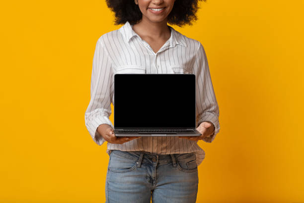 istock Laptop Computer With Black Screen In Hands On Unrecognizable Black Woman 1208522556
